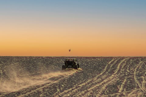 Off-road vehicle in desert rally environment