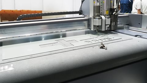 CNC cutting machine cutting detailed patterns from flat sheet material