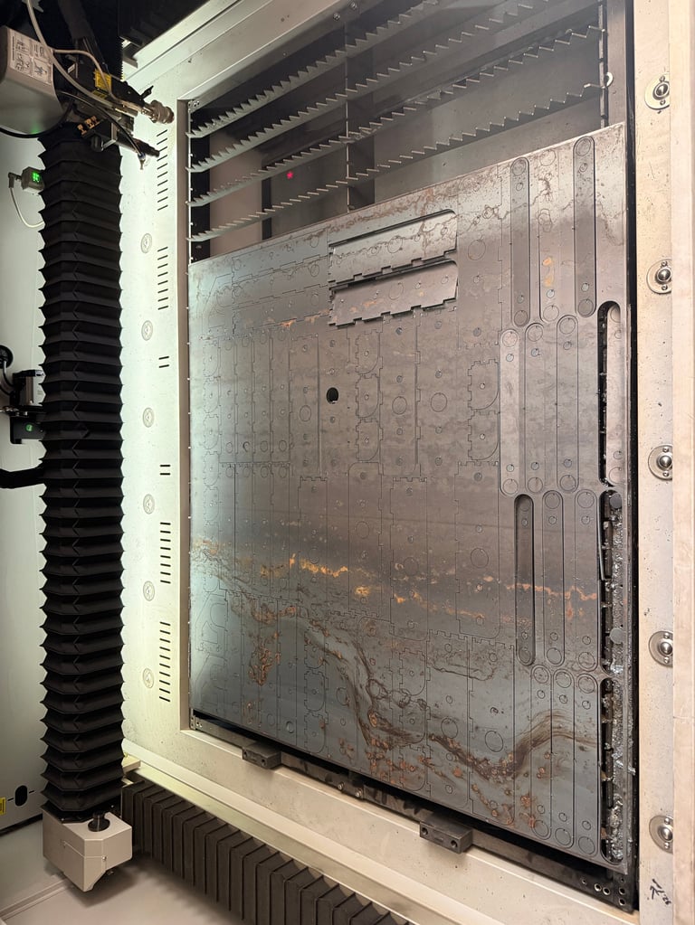 Interior view of an open electrical panel box showing internal wiring, circuit components, and a corroded metal backplate